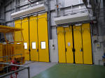 Train and delivery vehicle access swift bi-folding doors